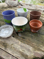 (G)Lot of Five Planters and Six 6” Plastic Saucers