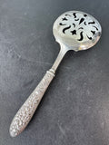 Floral Embossed Repoussé Slotted Spoon with Sterling Silver Handle