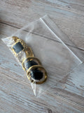 Trio of Black Stone Accented Gold Tone Earrings (H)