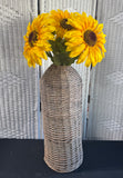 Faux Sunflowers in Wicker Woven Floor Vase