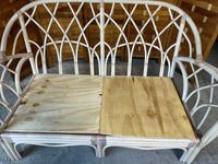 Wicker Sofa with Floral Cushions