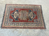 E-Hand Knotted Woollen Carpet, Coral/blue tones, 36"x27". Made in Pakistan.