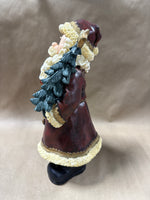 Santa Clause Holding Tree And Present Statue