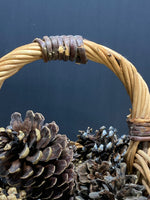 Woven Basket Full of Pinecones