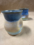 Pair Of Earth Tone Indented Pottery Cups