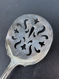 Floral Embossed Repoussé Slotted Spoon with Sterling Silver Handle