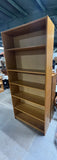 Tall Bookcase with Adjustable Shelves; Card board backing.