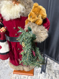 Standing Santa Holding Toys And Wreath