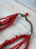 Red Beaded Torsade Necklace with Bronze Tone Filigree Pendant