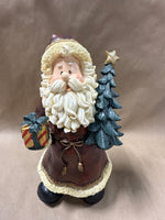 Santa Clause Holding Tree And Present Statue