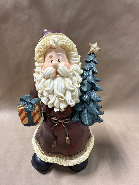 Santa Clause Holding Tree And Present Statue