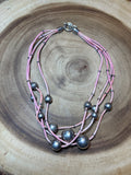Silver Beads on Multi Strands of Pink Cord Necklace
