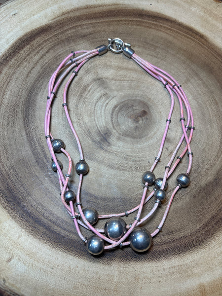 Silver Beads on Multi Strands of Pink Cord Necklace