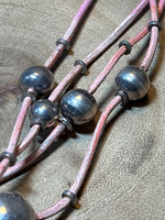 Silver Beads on Multi Strands of Pink Cord Necklace