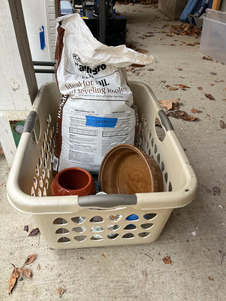 Planter Lot with Open Bag of Top Soil