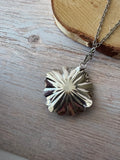 Silver Tone Textured Flower Pendant Necklace with Black Stone
