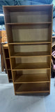 Tall Bookcase with Adjustable Shelves; Card board backing.