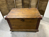 Antique Wooden Trunk with Metal Accents on Casters