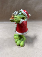 (A) Russ Douglas Christmas Santa Bobble Frog