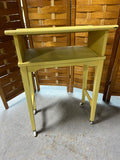 Yellow Painted Book Stand on Casters