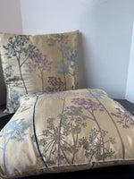 Pair of Champagne Throw Pillows with Multicolored Dandelions