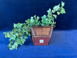 Artificial Greenery In Woven Planter