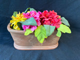 Faux Floral Arrangement in Decorative Terracotta Planter