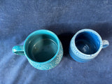 Pair Of Glazed Blue Pottery Mugs
