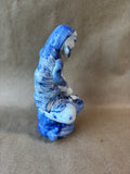 Blue and White Porcelain Seated Man Figurine