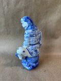 Blue and White Porcelain Seated Man Figurine