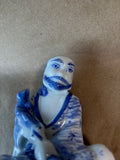 Blue and White Porcelain Seated Man Figurine