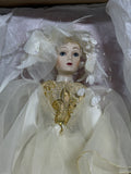 Whimsical Doll with Feathers and Gold Trim