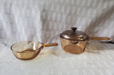 Pair of Corning Ware Visions Amber Glass Sauce Pans with One Lid