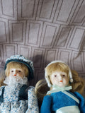(A) Pair of Small Dolls