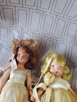 (B) Pair of Small Dolls