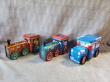 Lot of Tin Train/Truck Holiday Boxes