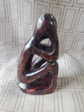 Carved Stone Sitting Person Sculpture