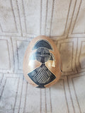 (A) Carved Stone Egg Figurine