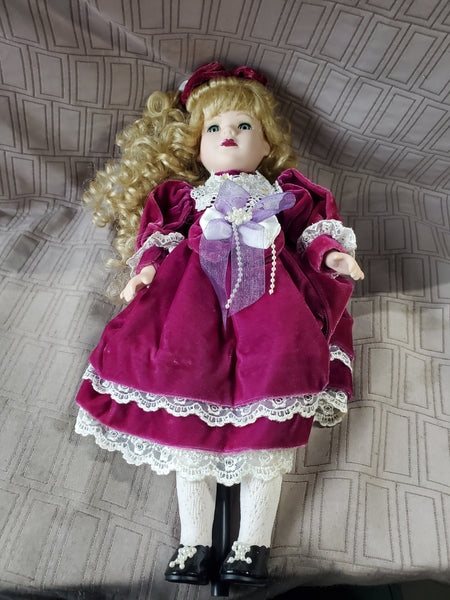 Vintage Porcelain Doll in Plum Dress