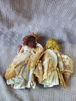 (B) Pair of Small Dolls