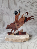 Metal Bull-Riding Sculpture on Stone