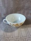 Gold Toned Floral Teacup and Saucer Set