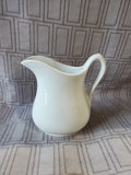 Small White Ceramic Cream Pitcher