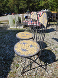 Two Black Metal Folding Chairs w/Yellow and Blue Mosaic Tile Seats