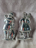 Pair of Silver Toned Resin Santa Figurines