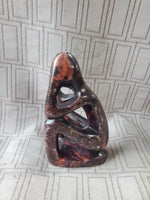 Carved Stone Sitting Person Sculpture