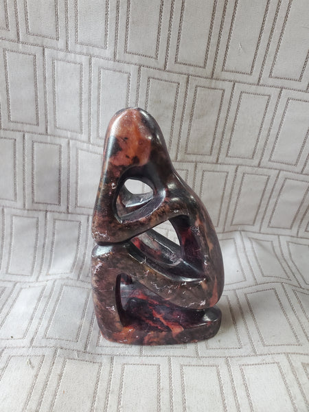 Carved Stone Sitting Person Sculpture