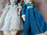(A) Pair of Small Dolls