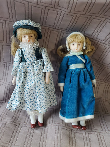 (A) Pair of Small Dolls