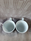 Pair of Lenox DKNY Mult-Colored Mugs (A)